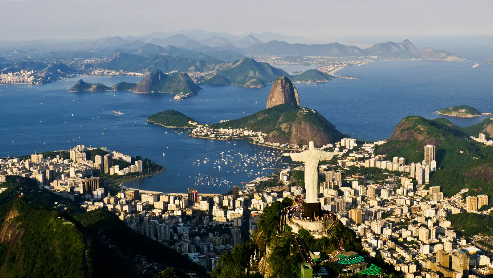 Christ the Redeemer above Rio de Janeiro, with Sugarloaf Mountain across the bay
