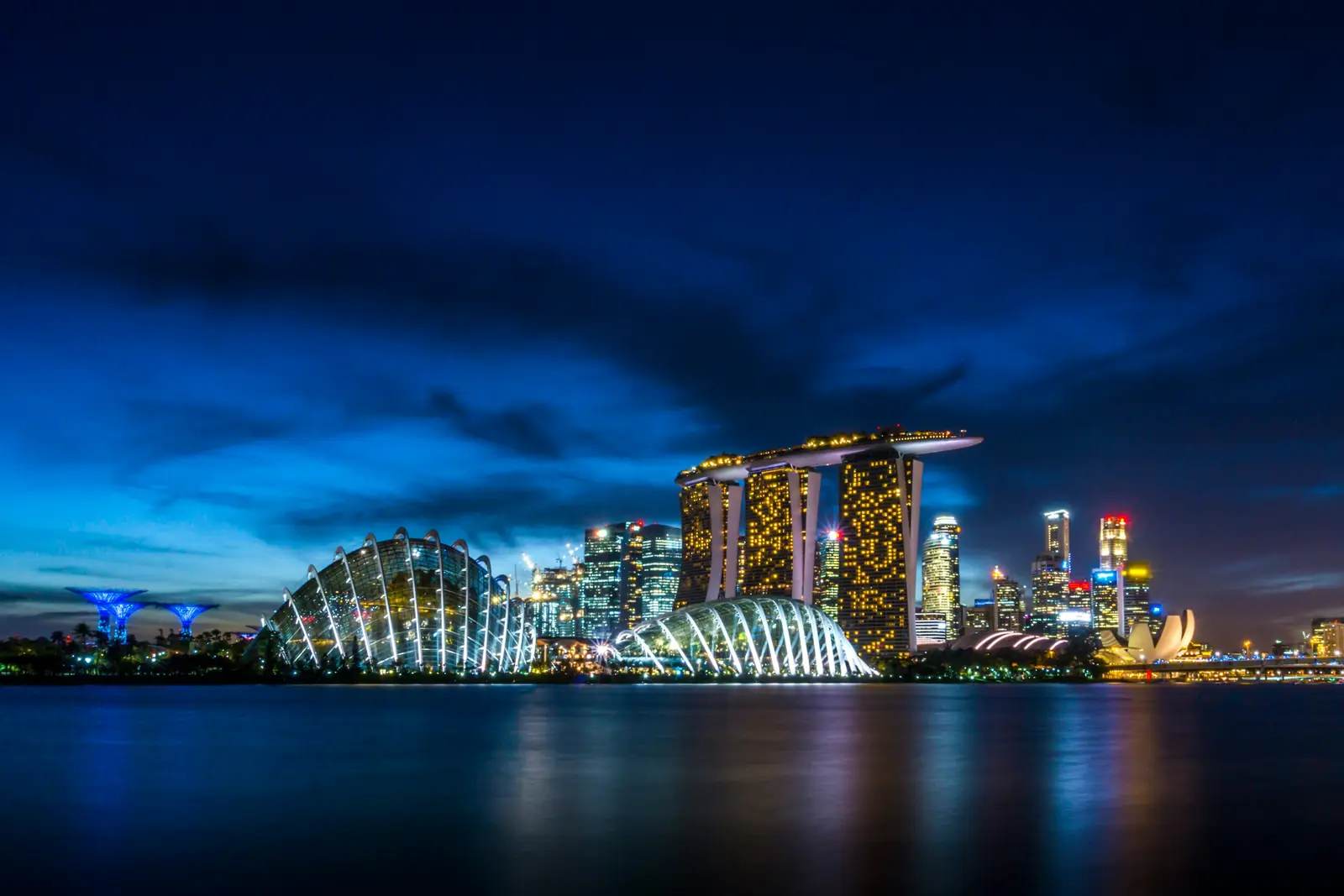 Marina Bay at night, Gardens by the Bay and Marina Bay Sands across the water