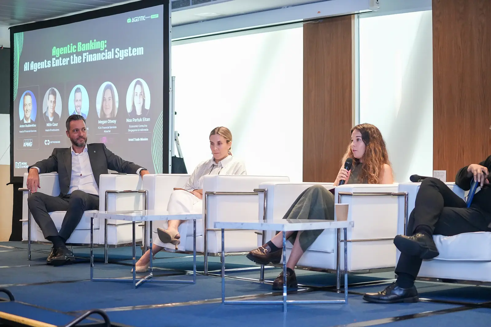 The Agentic Banking panel on stage in Singapore, its title on the screen behind