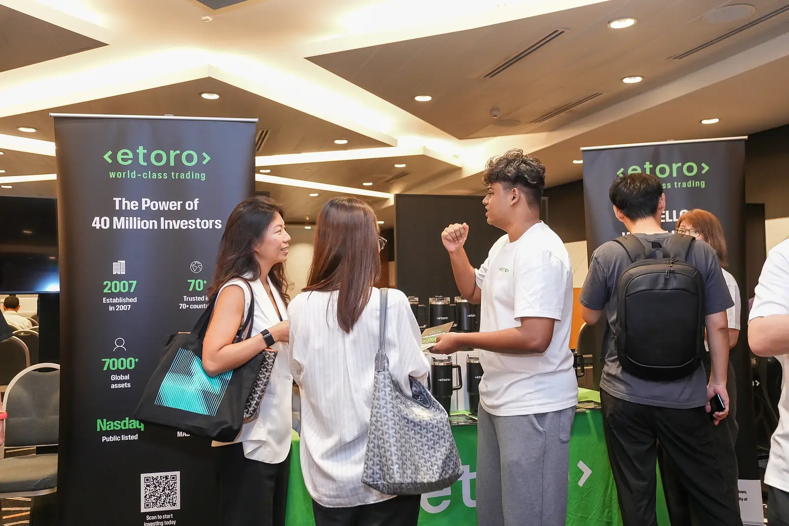 Visitors at eToro’s stand at Agentic Finance Singapore