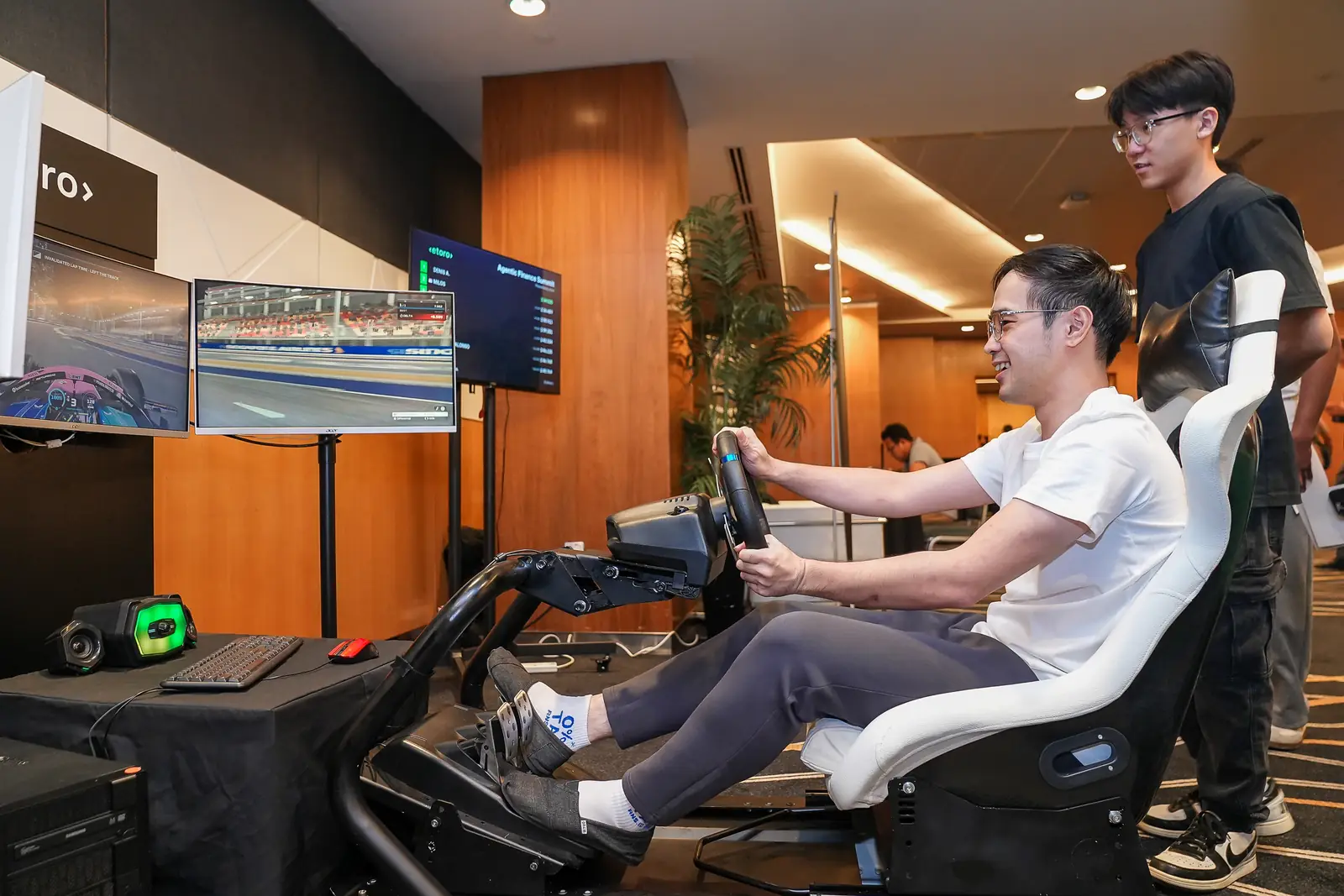 A guest racing on eToro’s F1 simulator in Singapore