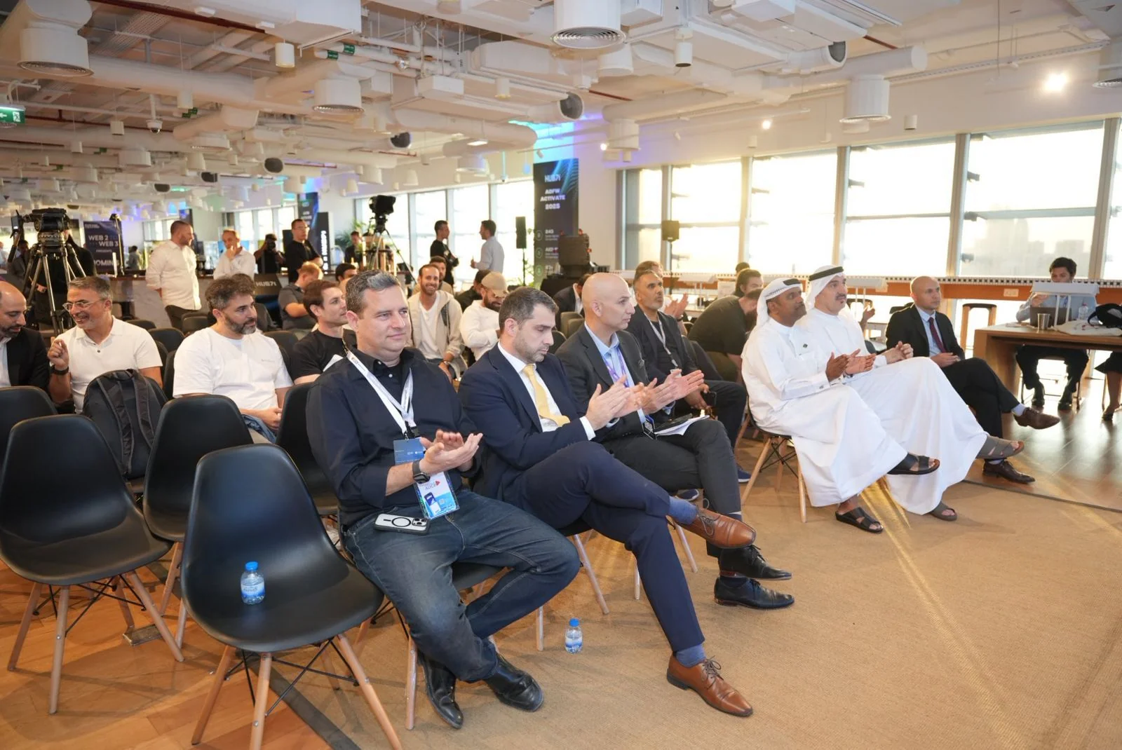 A More & More event in full flow, with a seated room of founders, investors and officials