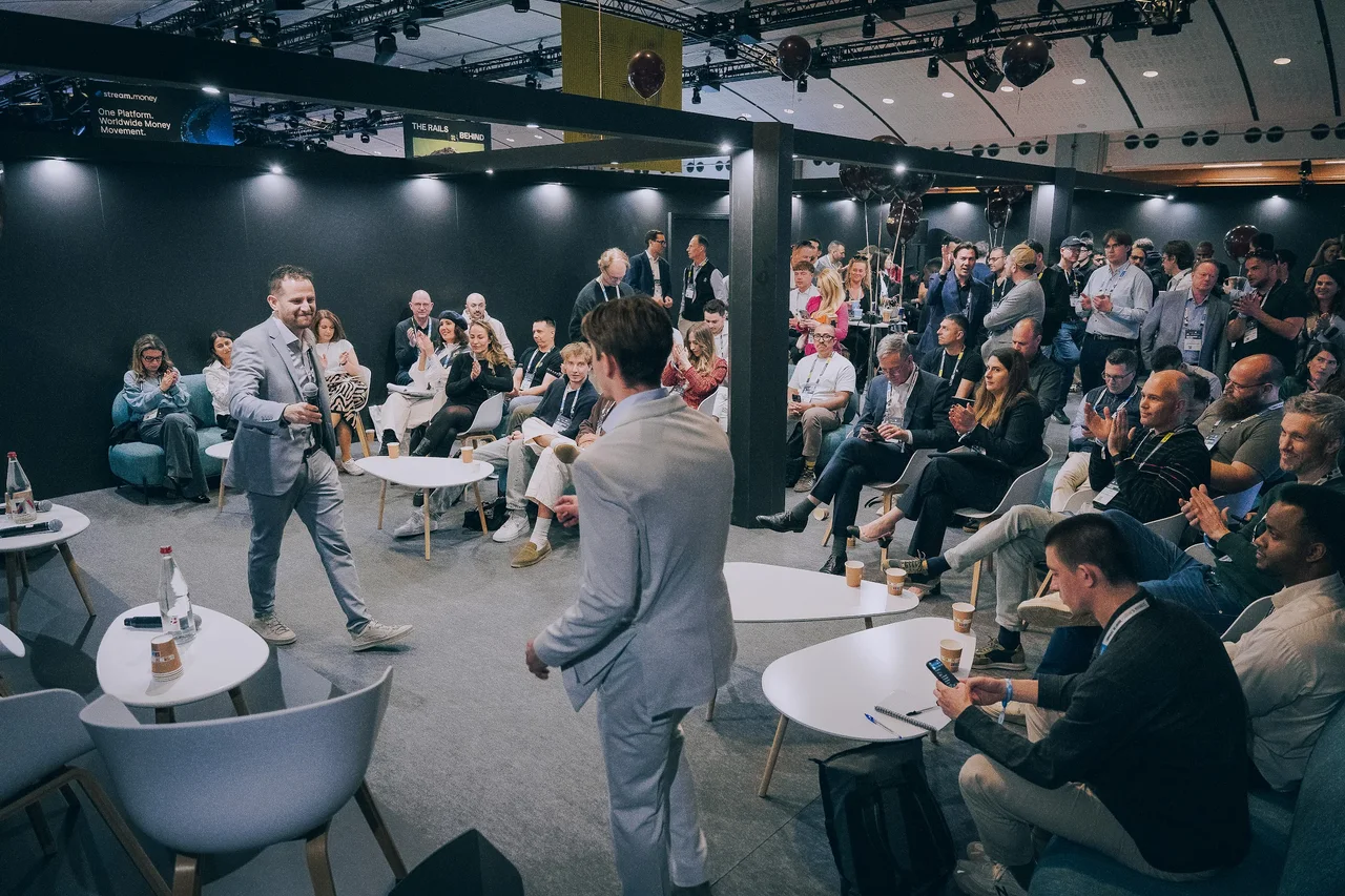 A full room at The Odds during Paris Blockchain Week - a speaker addressing a seated audience of founders, operators and investors under The Odds branding